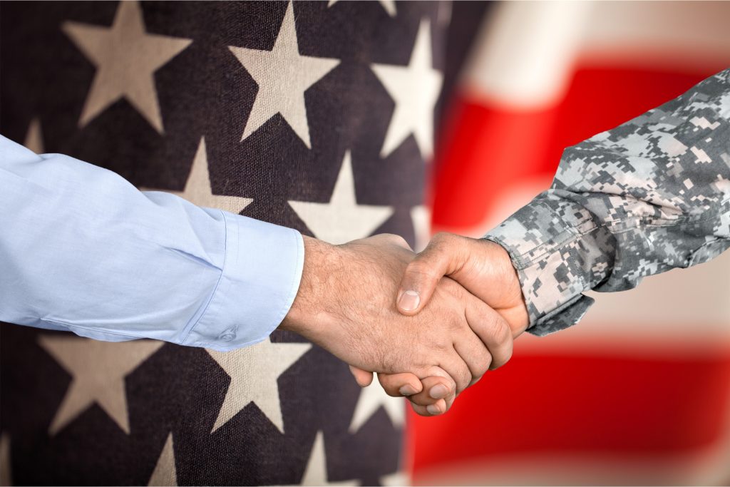 Two individuals shaking hands